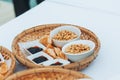 Napkin, bowls with raisins, peanuts, sunflower seeds