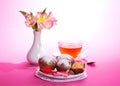 On a napkin cupcakes, tea and flowers Royalty Free Stock Photo