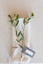 Napkin with sprigs of eucalyptus and a guest card in the design of the festive wedding table Royalty Free Stock Photo