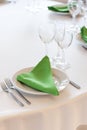 Napkins lies on a white plate. Served table for the holiday. Royalty Free Stock Photo