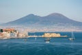 Naples, Campania, Italy. Vesuvio Volcano and Castel dell`Ovo in foreground