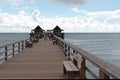 The long pier of caribbean beach of Naples in Florida