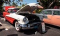 White and pink 1955 Oldsmobile 98 Deluxe Holiday Coupe at the 32nd Annual Naples Depot Classic Car Show