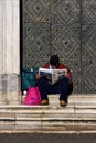 naples and a homeless reading a newspaper