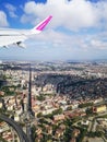 Aeroplane window view to clouds over Italy cities