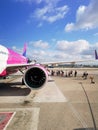 Big white purple and blue aeroplane of Wizzair on airport