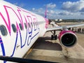 Big white purple and blue aeroplane of Wizzair on airport