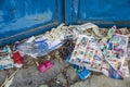 Naples, Italy - August 11, 2015 : Lots of garbage and grapes are on the roadside in front of a metal gate