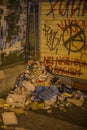 Naples, Italy - August 15, 2015 : Lots of garbage and grapes are on the roadside in front of a metal gate