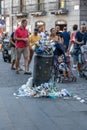 Naples, Italy - August 15, 2019: Overloaded trash can in Naples hitoric city center in summer