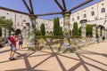 Cloister Santa Chiara with octagonal columns decorated with majolica tiles in rococo style, Naples, Italy