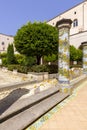 Cloister Santa Chiara with octagonal columns decorated with majolica tiles in rococo style, Naples, Italy