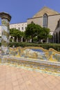 Cloister Santa Chiara with octagonal columns decorated with majolica tiles in rococo style, Naples, Italy