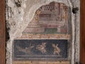 NAPLES, ITALY- JUNE, 13, 2019: fresco painting of a mythological scene on a house wall at pompeii