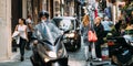 Naples, Italy. Man Riding On Scooter At Vico Lungo Del Gelso Street. Traffic On Famous Narrow Street.