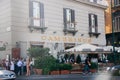 People stay at old cafe Gambrinus on Piazza Trieste Trento