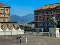 Monumental Plebiscite Square in Naples, Italy, with historic buildings and the outline of the Vesevius volcano Royalty Free Stock Photo