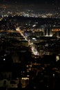 Nighttime view of the city of Naples, featuring the skyline adorned with illuminated buildings