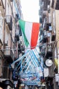 Photograph taken in the city of Naples, Italy, capturing the city adorned with banners during the Napoli football club