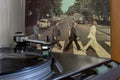 Naples, record player with the Beatles vinyls Abby Road on background.