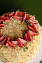 Napoleon cake with fresh strawberries on top served on a white plate with blurred background. Dessert time Royalty Free Stock Photo