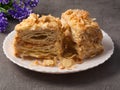 Napoleon cake. a piece of airy tender puff pastry on a plate