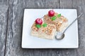 Napoleon cake with wild apples and mint on squared plate Royalty Free Stock Photo