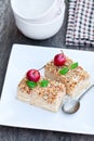 Napoleon cake with wild apples and mint on squared plate Royalty Free Stock Photo