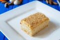 Napoleon or millefeuille cake close up sliced on square plate Royalty Free Stock Photo