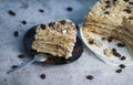 Napolion cake. A piece of cake on a black plate Royalty Free Stock Photo