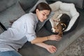 A young woman lying next to her puppy and having a nap Royalty Free Stock Photo