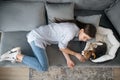 A young woman lying next to her puppy and having a nap Royalty Free Stock Photo