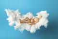 Napping toy man on comfortable cloud bed. Relax and dream Royalty Free Stock Photo