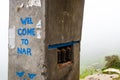 Gate entrance and welcome sign at Nar village on foggy trekking path in Annapurna Conservation Area, Nepal