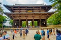 Nara, Japan - July 26, 2017: Crowd of people walking near ay Nandaimon, the Great Southern Gate at night. The gate is a