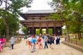 Nara, Japan - July 26, 2017: Crowd of people walking near ay Nandaimon, the Great Southern Gate at night. The gate is a