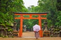 Tourist, red torii gate, Kasuga Taisha Shrine, Nara, Japan Royalty Free Stock Photo