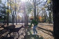 Young tourist feeds deer at the park in Nara, Japan