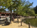 Nara Park. People rest on the territory of the temple near the lake. KYOTO, JAPAN Royalty Free Stock Photo