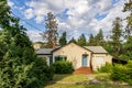 NARAMATA, CANADA - JULY 5, 2020: Cute small country private house with garden on sunny summer day