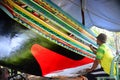 Man painting Malayu style art on boat.is call