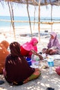A group of muslim women enjoying lunch on the beach Royalty Free Stock Photo