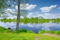 The Narew River Scenery. Old boat on riverbank.