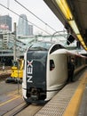 Narita Express train at Shinjuku station with Cocoon tower background Royalty Free Stock Photo