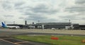 Narita International Airport view, Airplane parking at passenger gate. Royalty Free Stock Photo