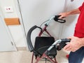 Narrabri, NSW/Australia - 12/03/2017: Elderly man with Alzheimer`s Disease shuffling along holding his wheeled mobility walker.