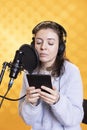 Narrator using storytelling skills while reading ebook, recording audiobook