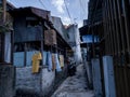 A narrow alley with crowded houses