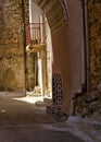 Narrow alley with decorated faucet sink, in Pyrgi  medieval village, Chios island, Greece Royalty Free Stock Photo