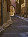 Narrow alley with decorated tunnel, in Pyrgi  medieval village, Chios island, Greece Royalty Free Stock Photo